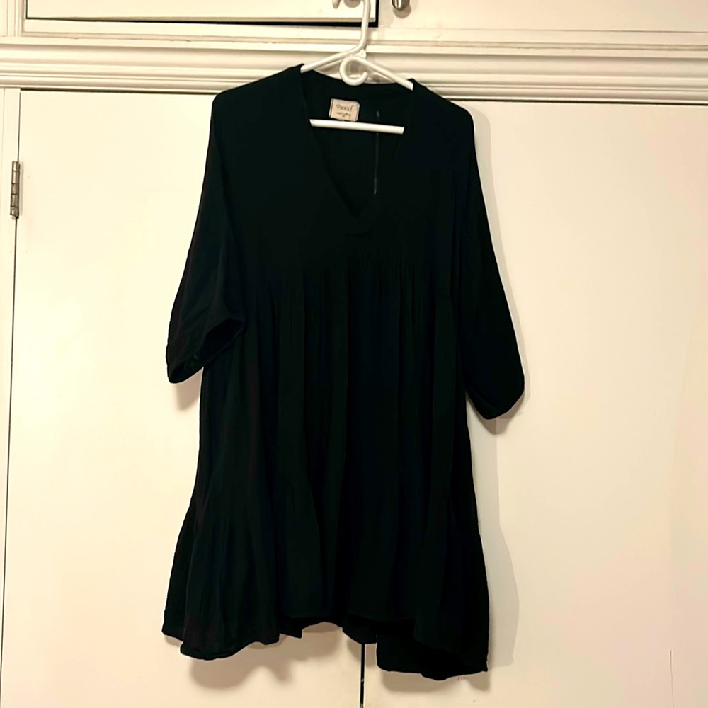 All cotton, tiered loose dress with pockets.